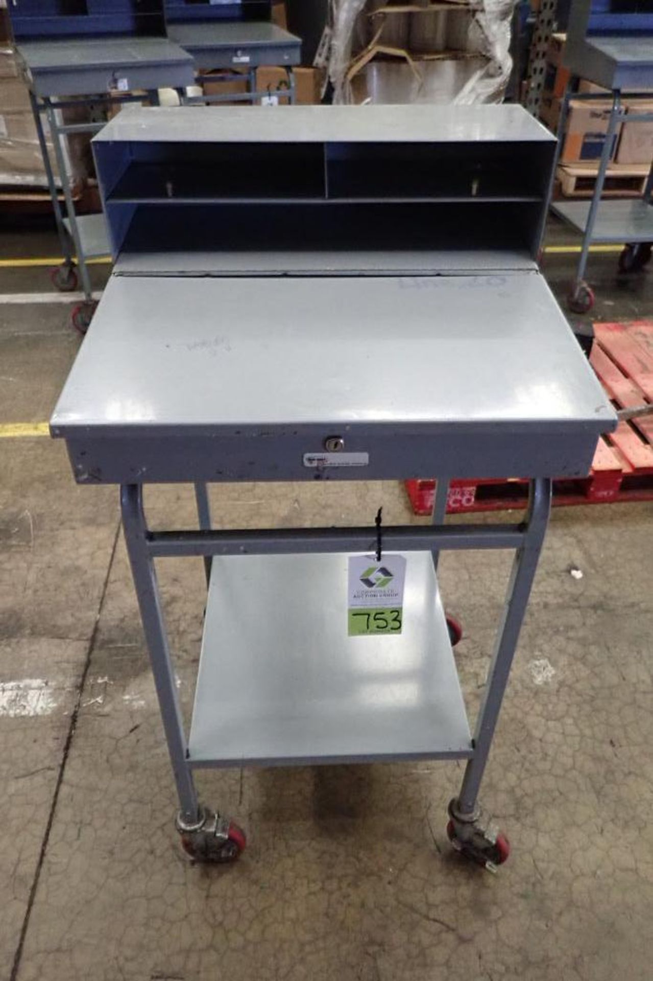 Win-Holt mild steel shipping desk on casters. **Rigging Fee: $10**
