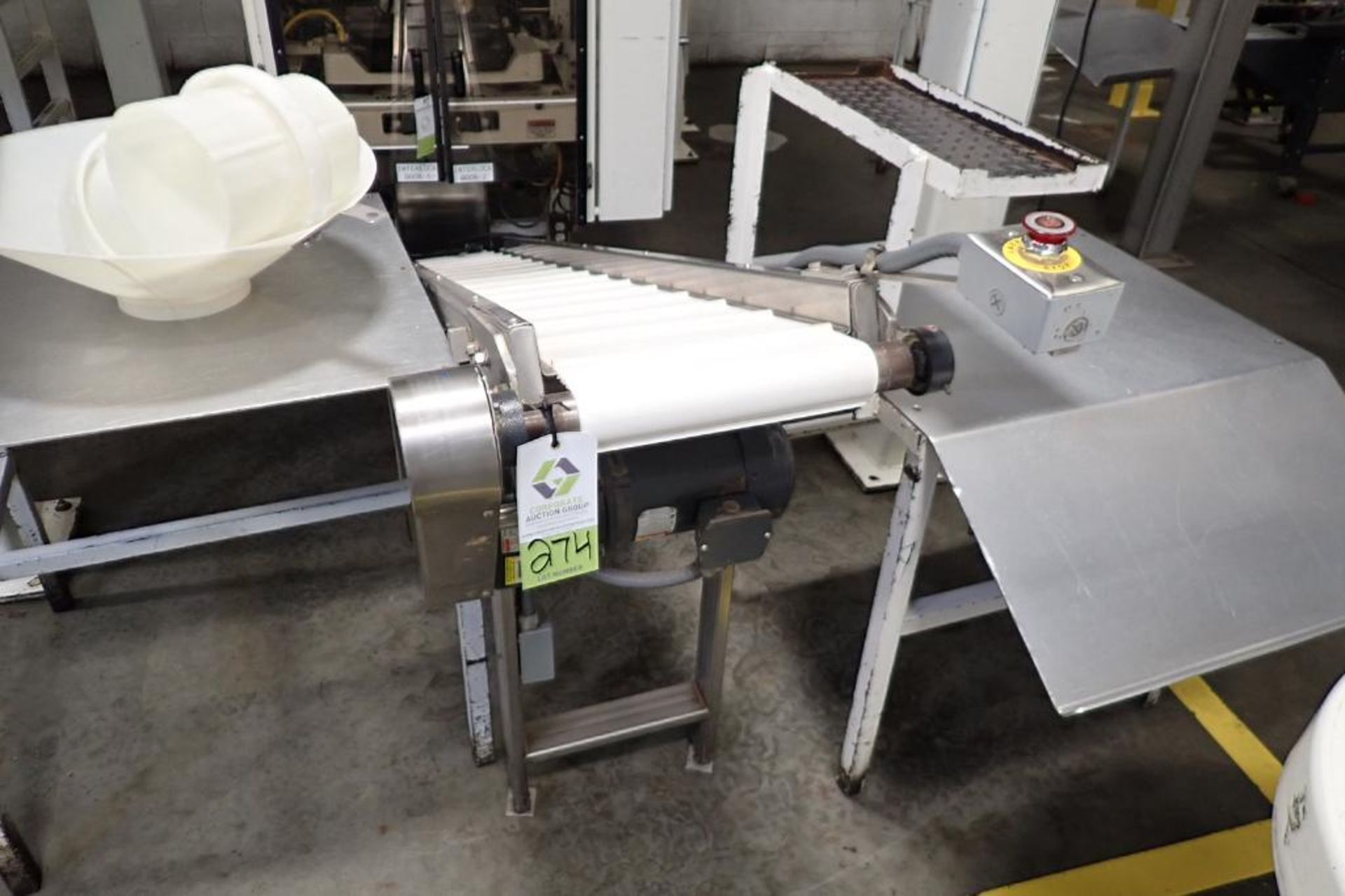 SS incline cleated belt conveyor, 9 ft. long x 12 in. wide, 42 in. discharge. **Rigging Fee: $200**