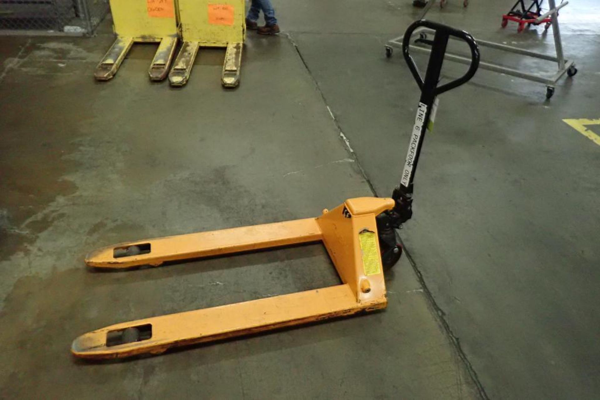 Global Industrial pallet jack, 5500 lb. capacity, SN E689118, yellow.. **Rigging Fee: $10**
