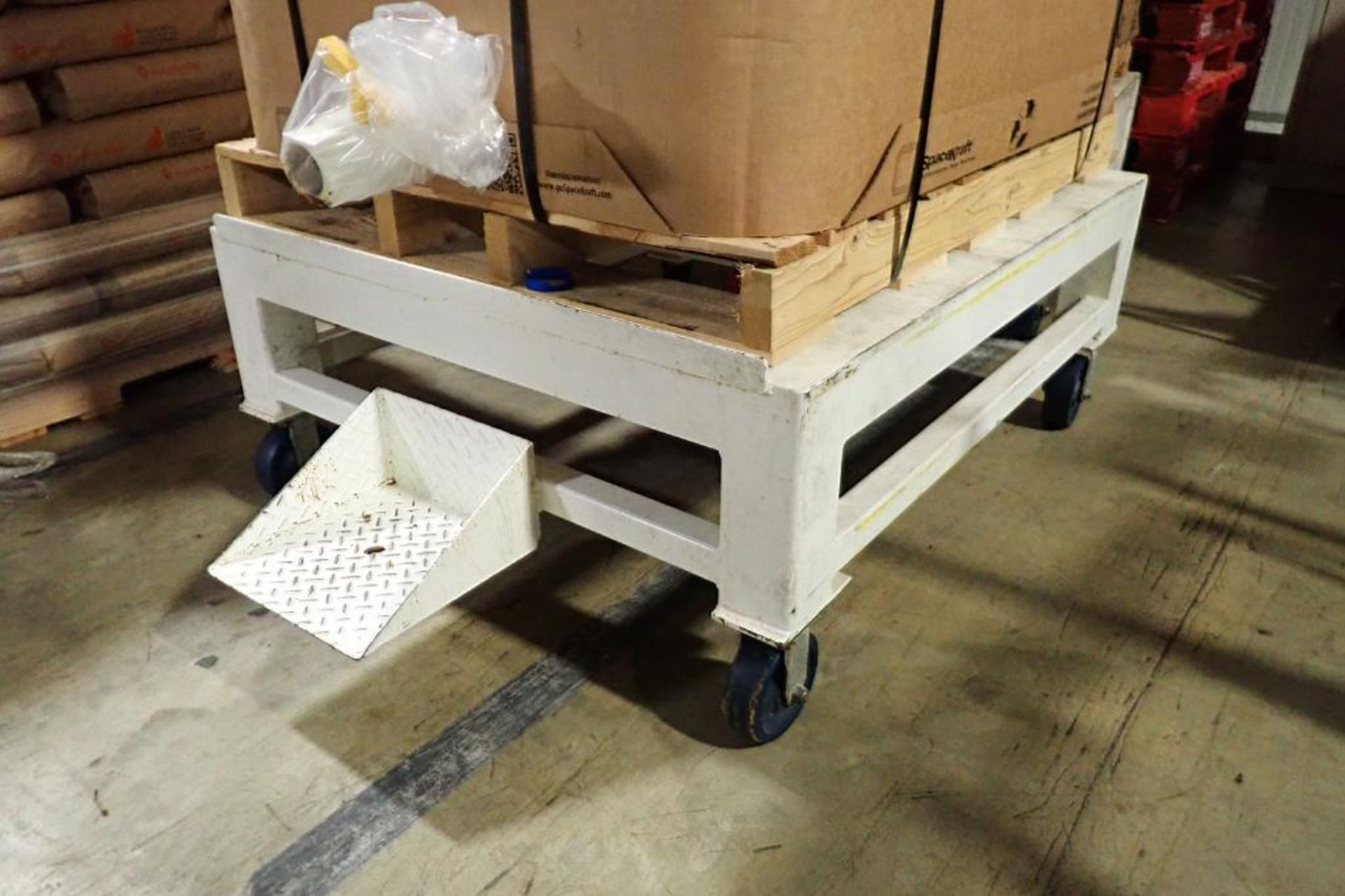 (2) mild steel pallet platforms, 46 in. long x 46 in. wide x 20 in. tall, on casters. **Rigging Fee: