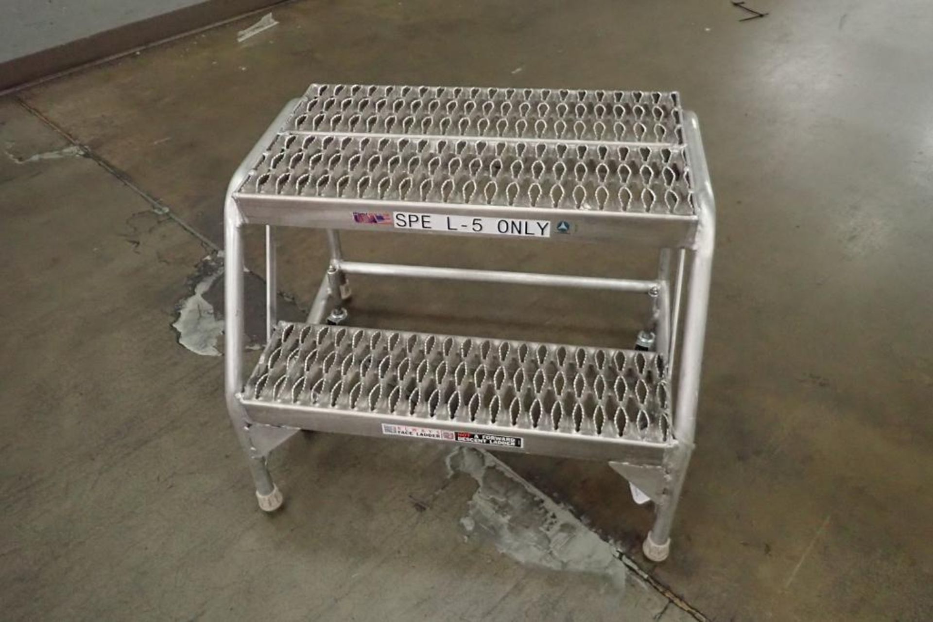 Cotterman 2-step aluminum rolling ladder. **Rigging Fee: $25**