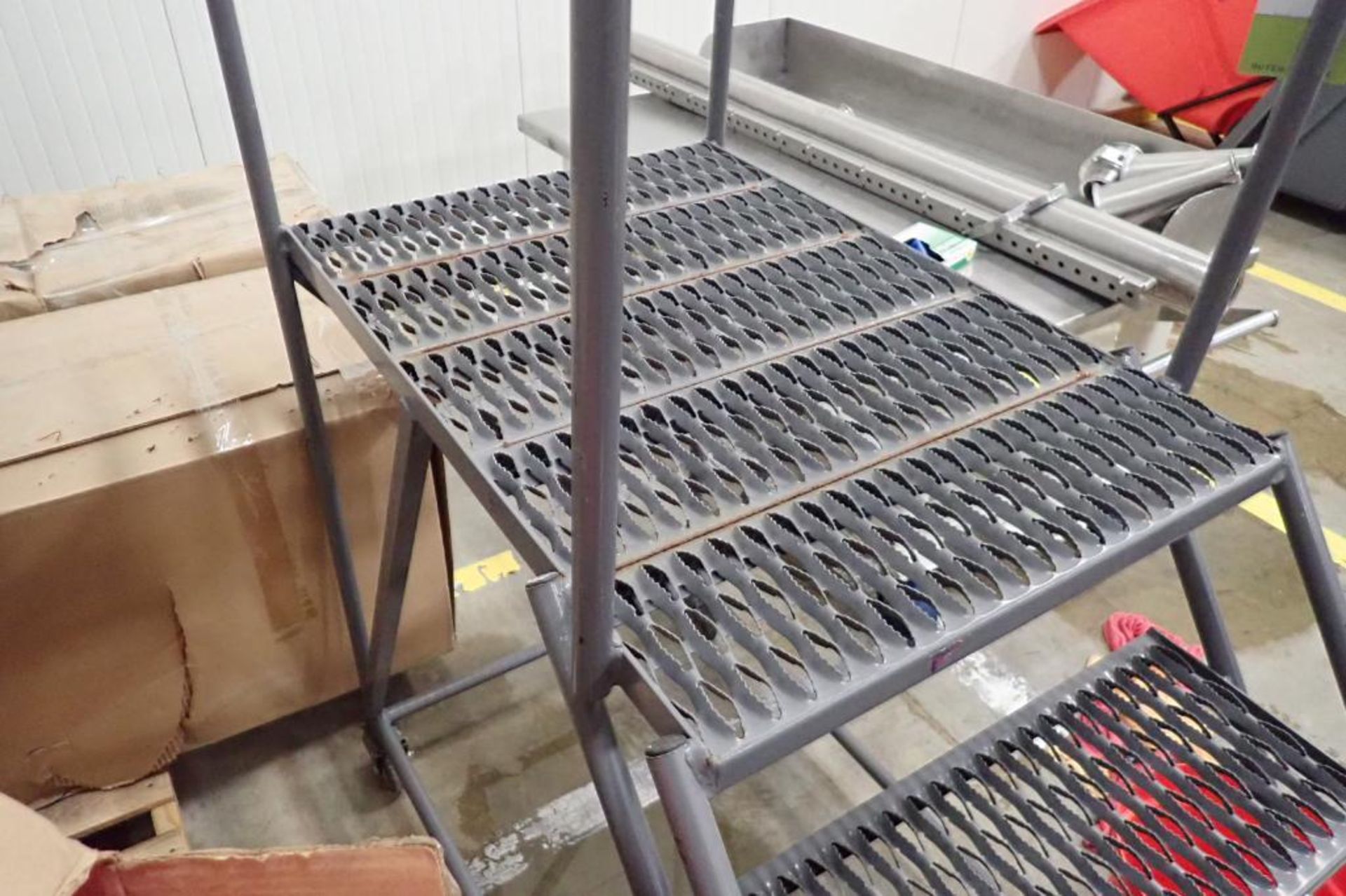 4-step Tri-Arc rolling warehouse ladder. **Rigging Fee: $50** - Image 3 of 4