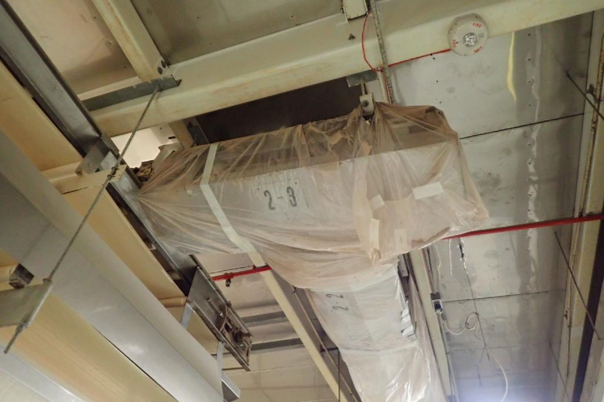 SS belt conveyor, 72 in. long x 18 in. wide, suspended from ceiling. **Rigging Fee: $250** - Image 2 of 3