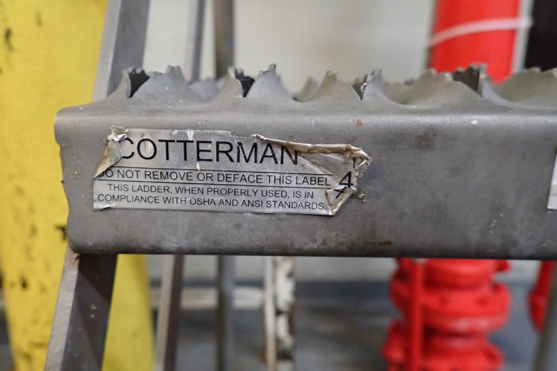 Cotterman 4-step stainless steel rolling warehouse ladder. **Rigging Fee: $10** - Image 3 of 4