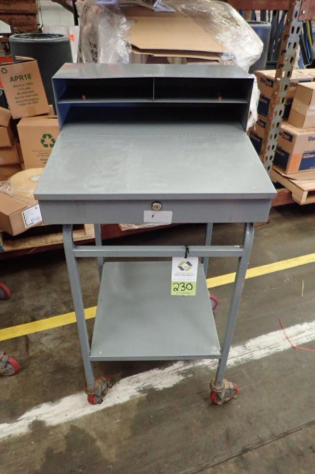 Win-Holt mild steel shipping desk on casters. **Rigging Fee: $10**