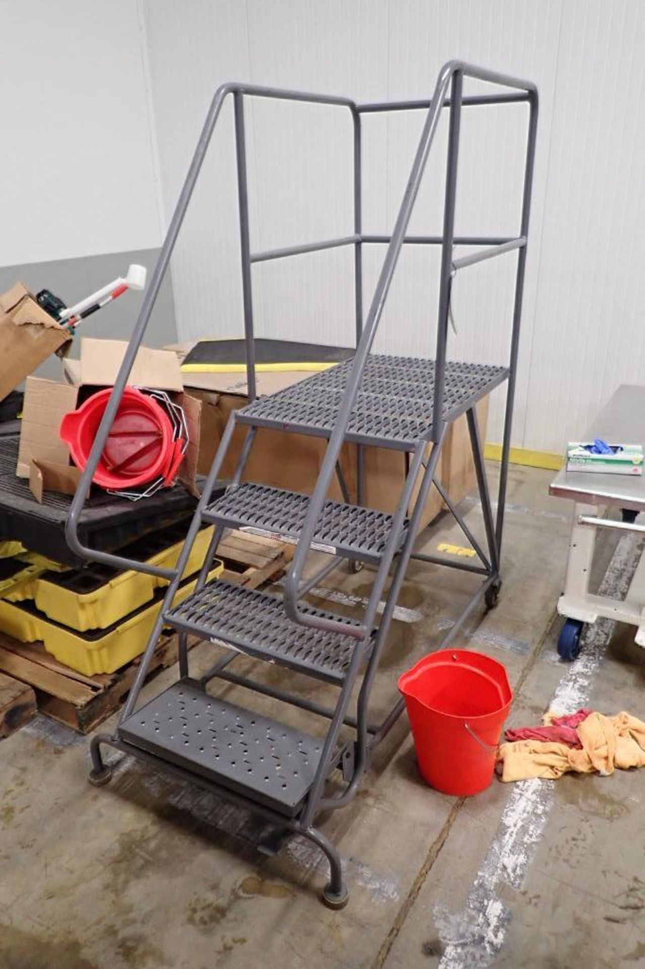 4-step Tri-Arc rolling warehouse ladder. **Rigging Fee: $50**