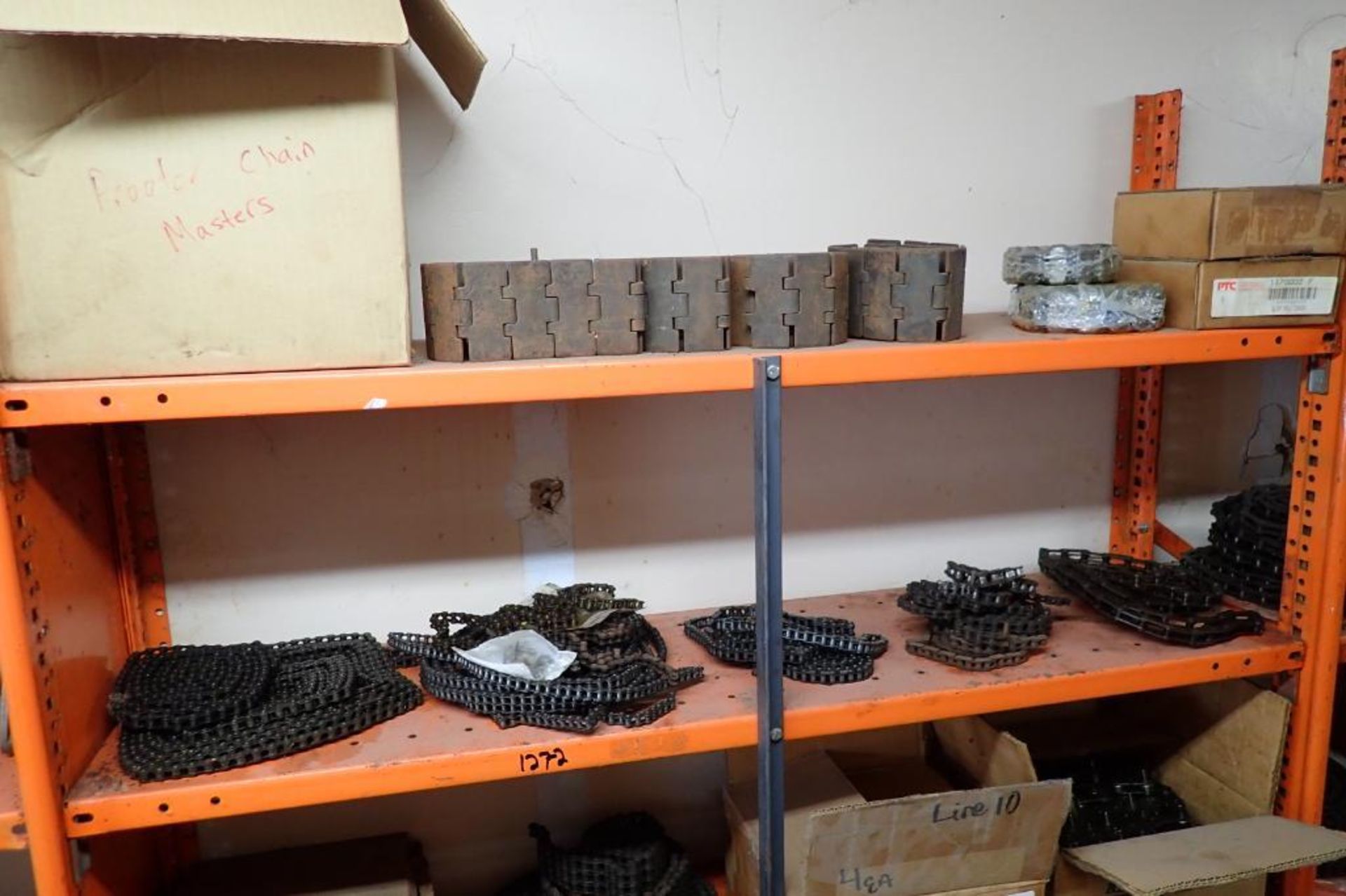 Contents only of 4 sections of shelving of assorted parts, gears, lug chain. **Rigging Fee: $150** - Image 16 of 21
