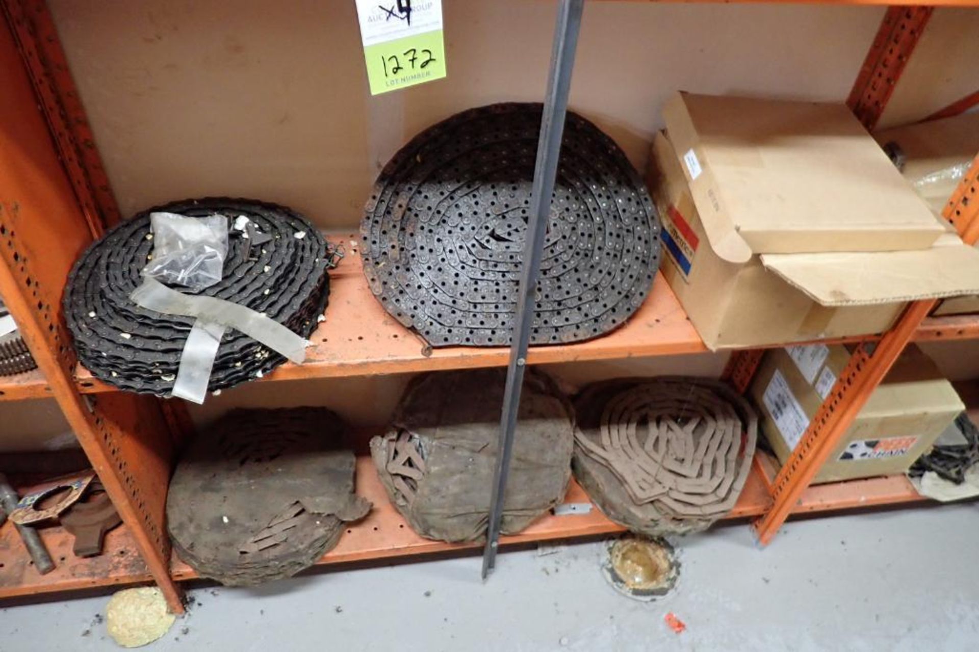 Contents only of 4 sections of shelving of assorted parts, gears, lug chain. **Rigging Fee: $150** - Image 13 of 21