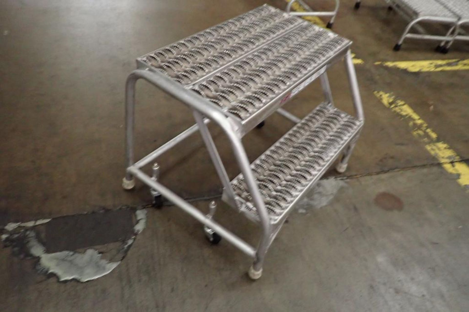 Cotterman 2-step aluminum rolling ladder. **Rigging Fee: $25** - Image 3 of 4