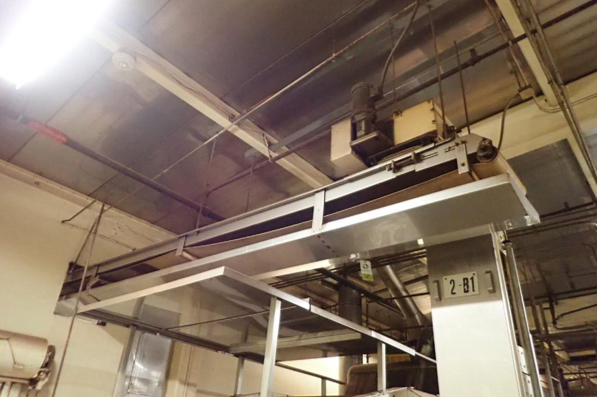 SS belt conveyor, 32 ft. long x 18 in. wide, suspended from ceiling. **Rigging Fee: $600**