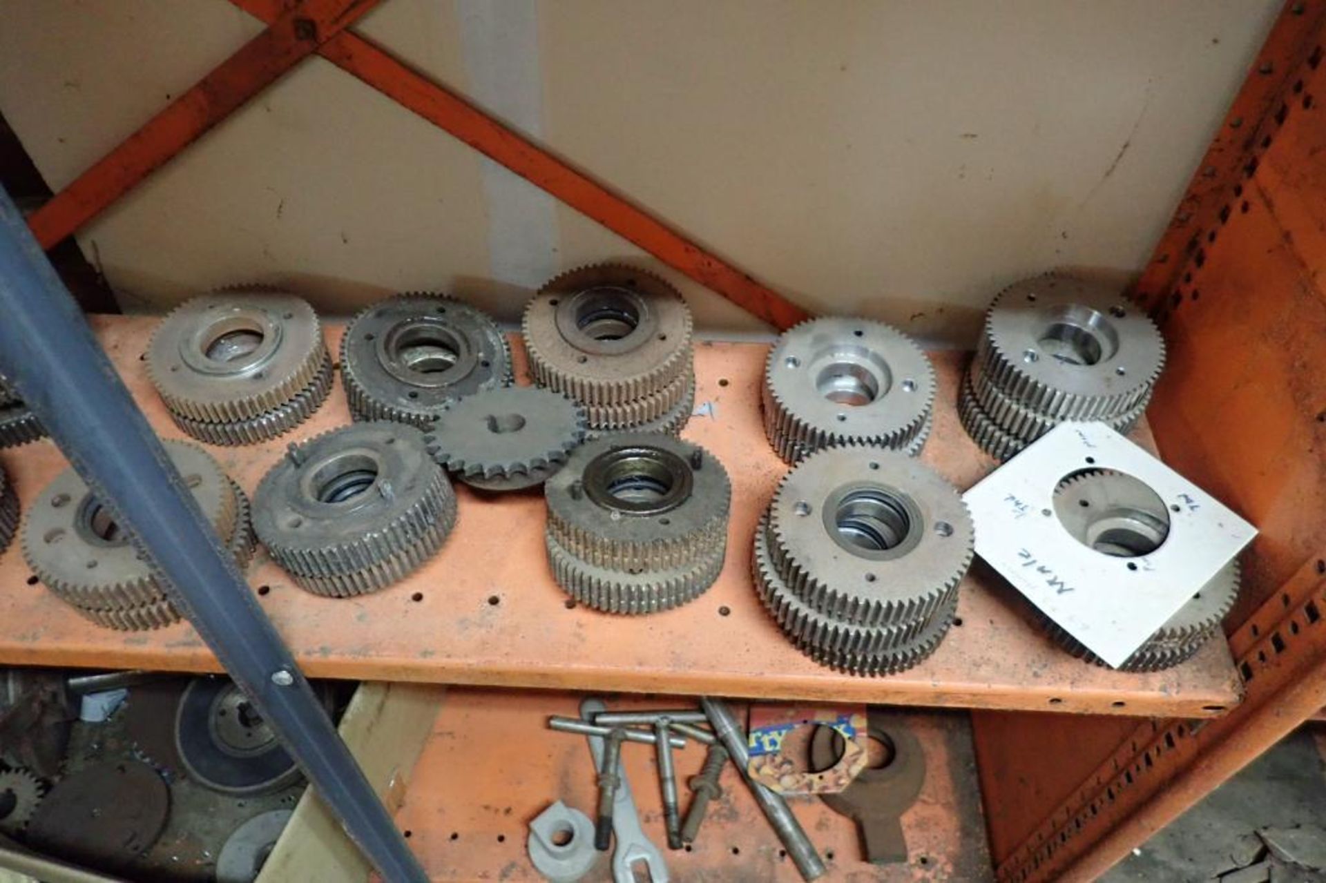 Contents only of 4 sections of shelving of assorted parts, gears, lug chain. **Rigging Fee: $150** - Image 12 of 21