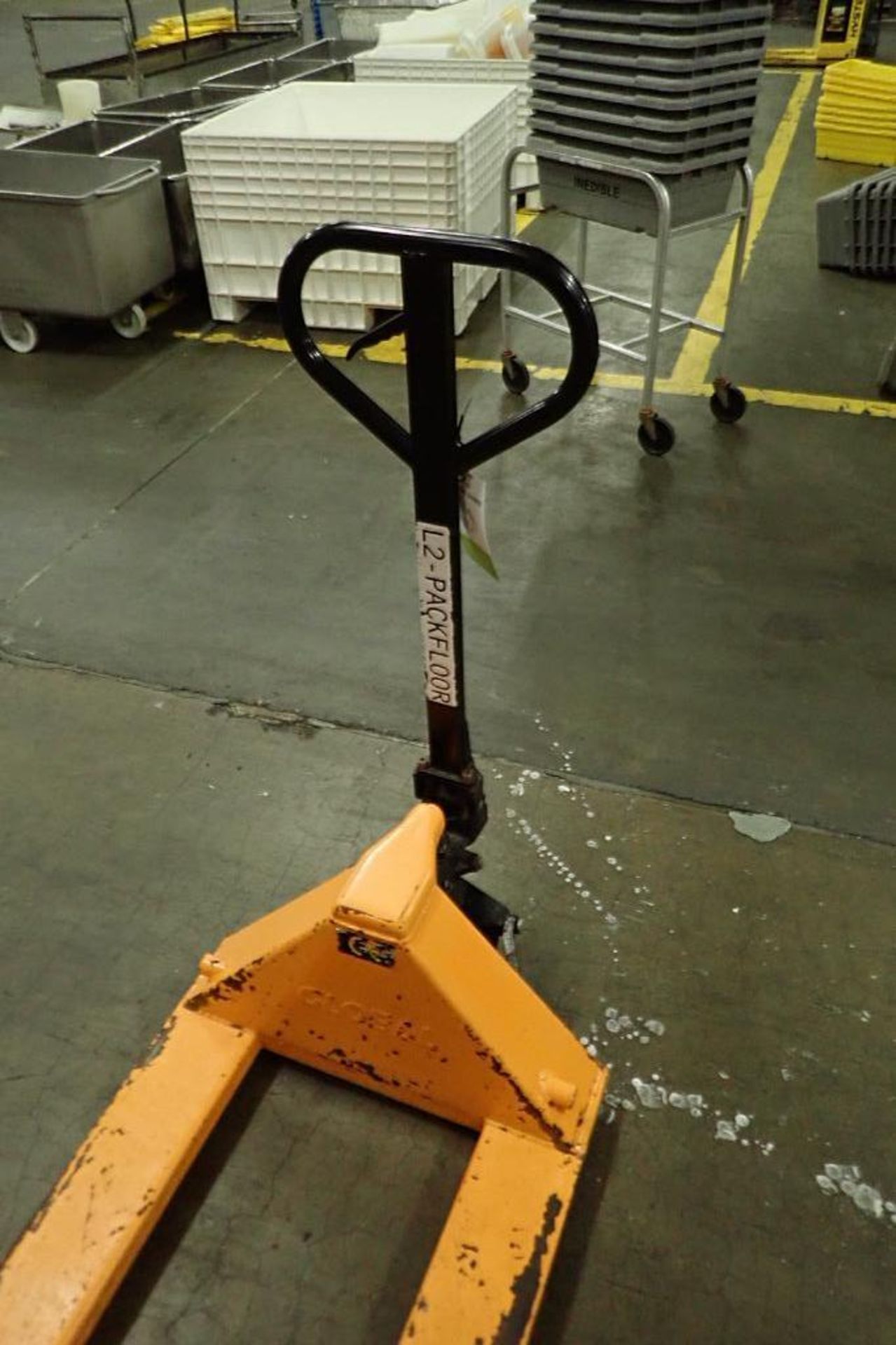 Global Industrial pallet jack, 5500 lb. capacity, SN E689044, yellow. **Rigging Fee: $10** - Image 2 of 5