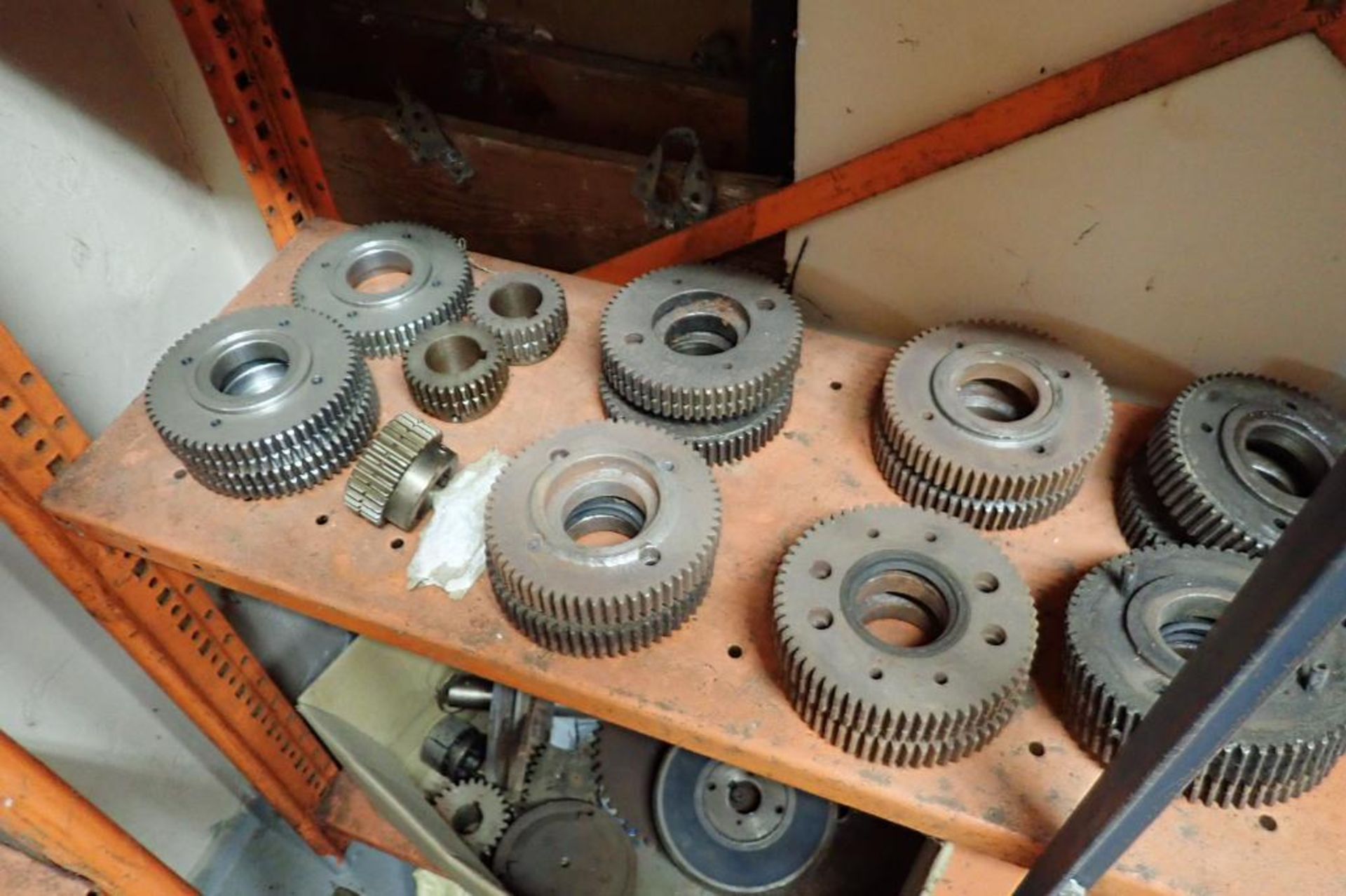 Contents only of 4 sections of shelving of assorted parts, gears, lug chain. **Rigging Fee: $150** - Image 11 of 21