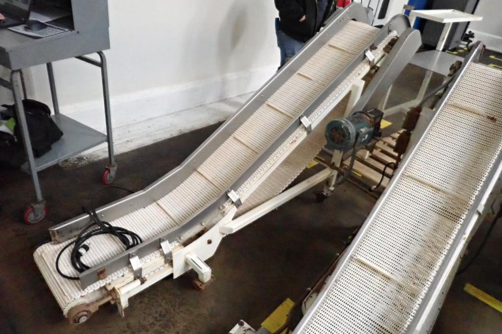 Mild Steel white cleated interlock belt conveyor, 8 ft. long x 12 in. wide, 42 in. discharge, on cas