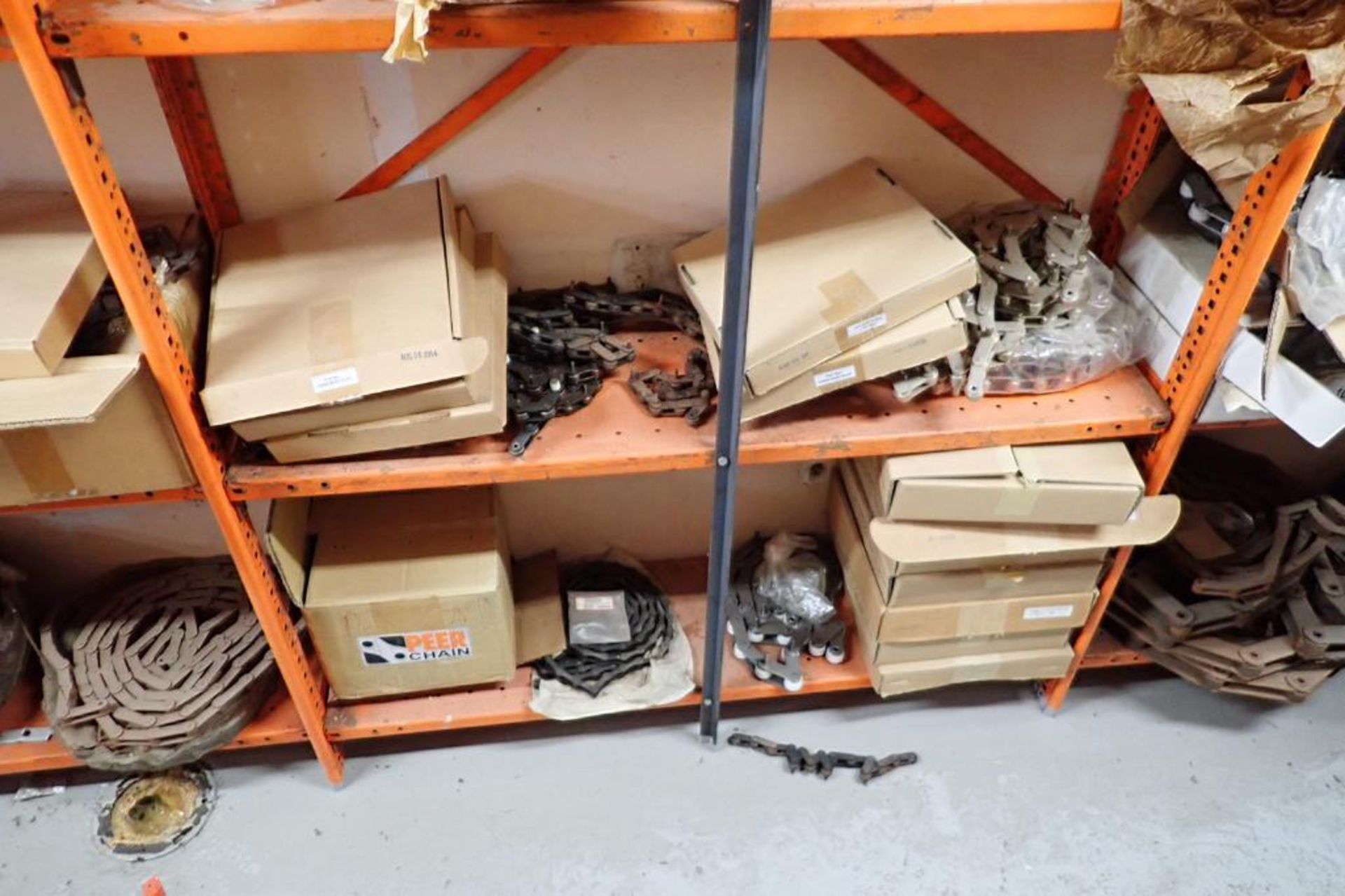 Contents only of 4 sections of shelving of assorted parts, gears, lug chain. **Rigging Fee: $150** - Image 17 of 21