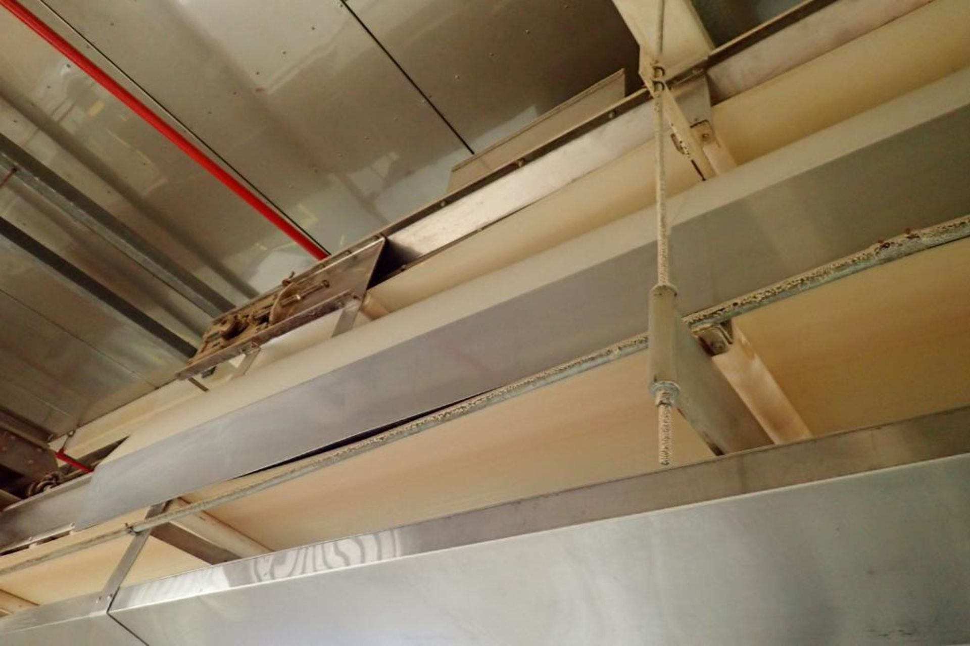 SS belt conveyor, 135 ft. long x 18 in. wide, suspended from ceiling. **Rigging Fee: $1250** - Image 4 of 5