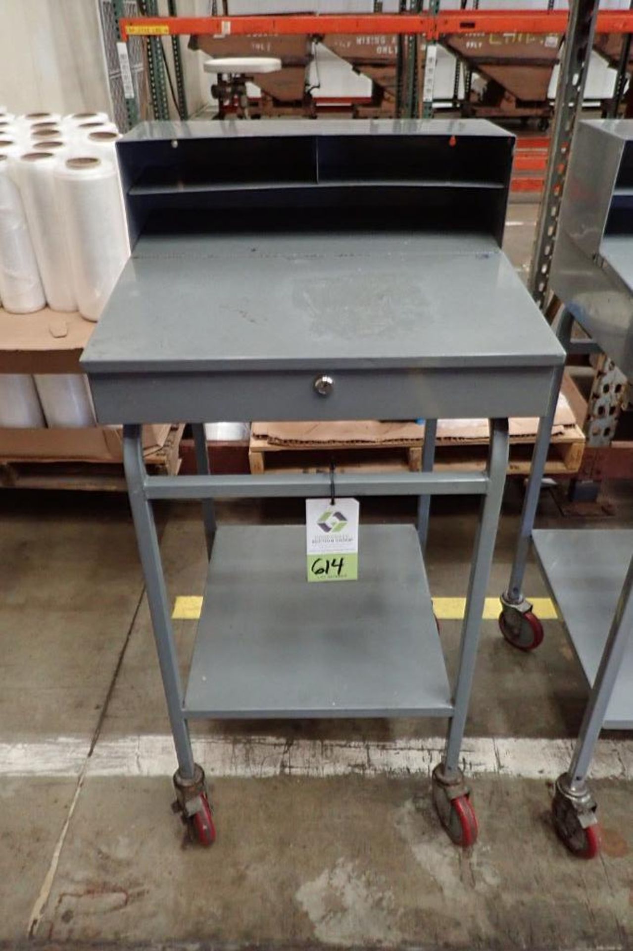 Win-Holt mild steel shipping desk on casters. **Rigging Fee: $10**