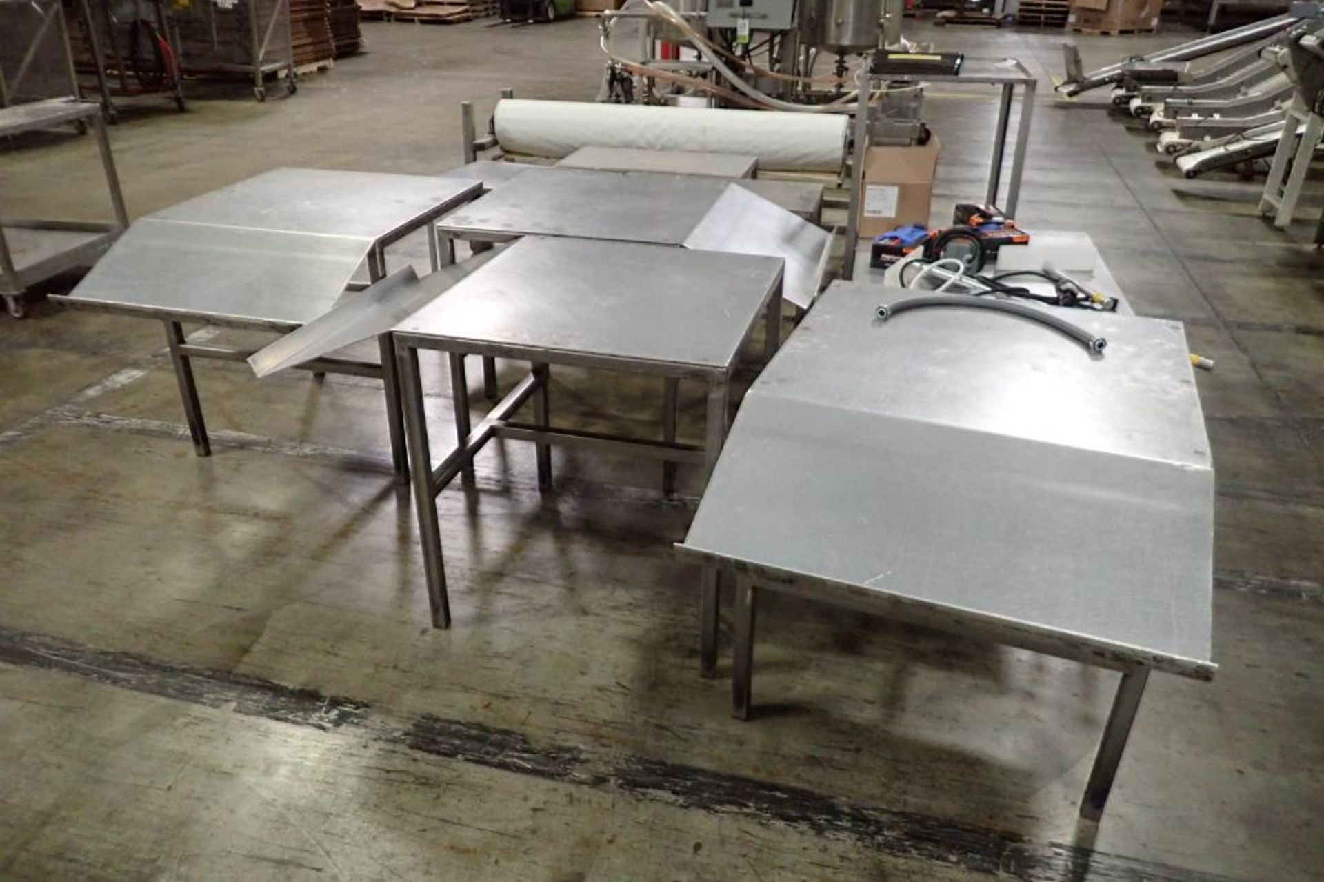 Lot of assorted SS tables. **Rigging Fee: $350** - Image 2 of 6