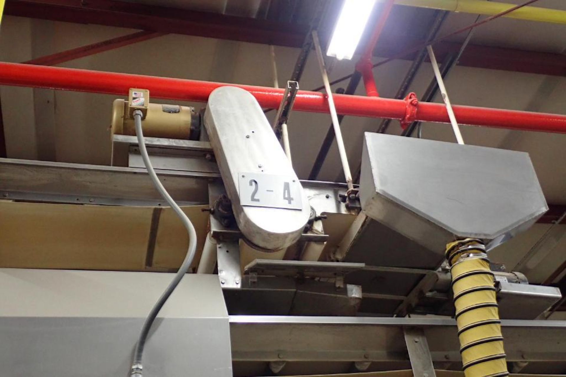SS belt conveyor, 135 ft. long x 18 in. wide, suspended from ceiling. **Rigging Fee: $1250**