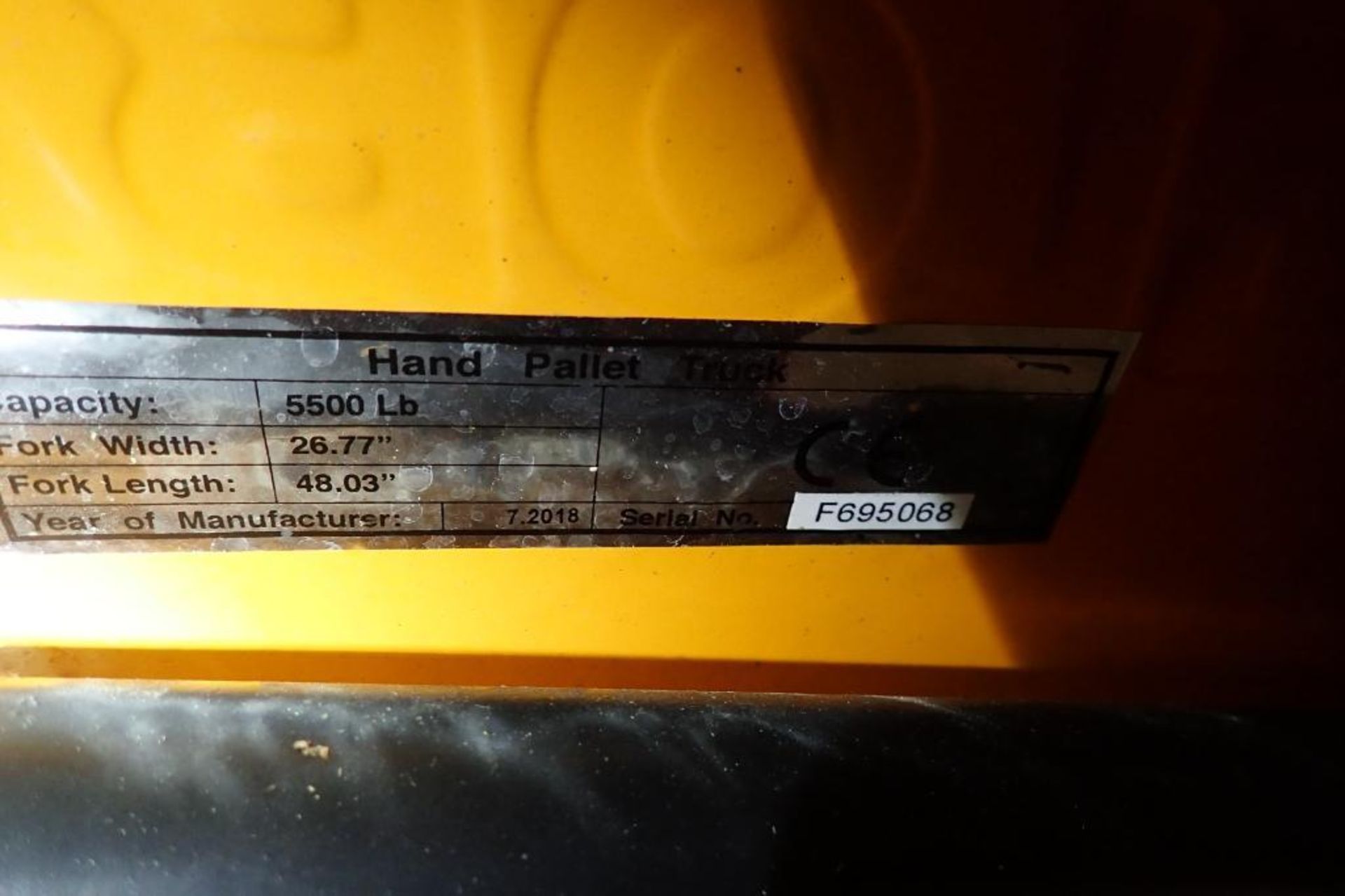 Global Industrial 5500 lb hand pallet jack, SN F695068, yellow. **Rigging Fee: $10** - Image 6 of 6