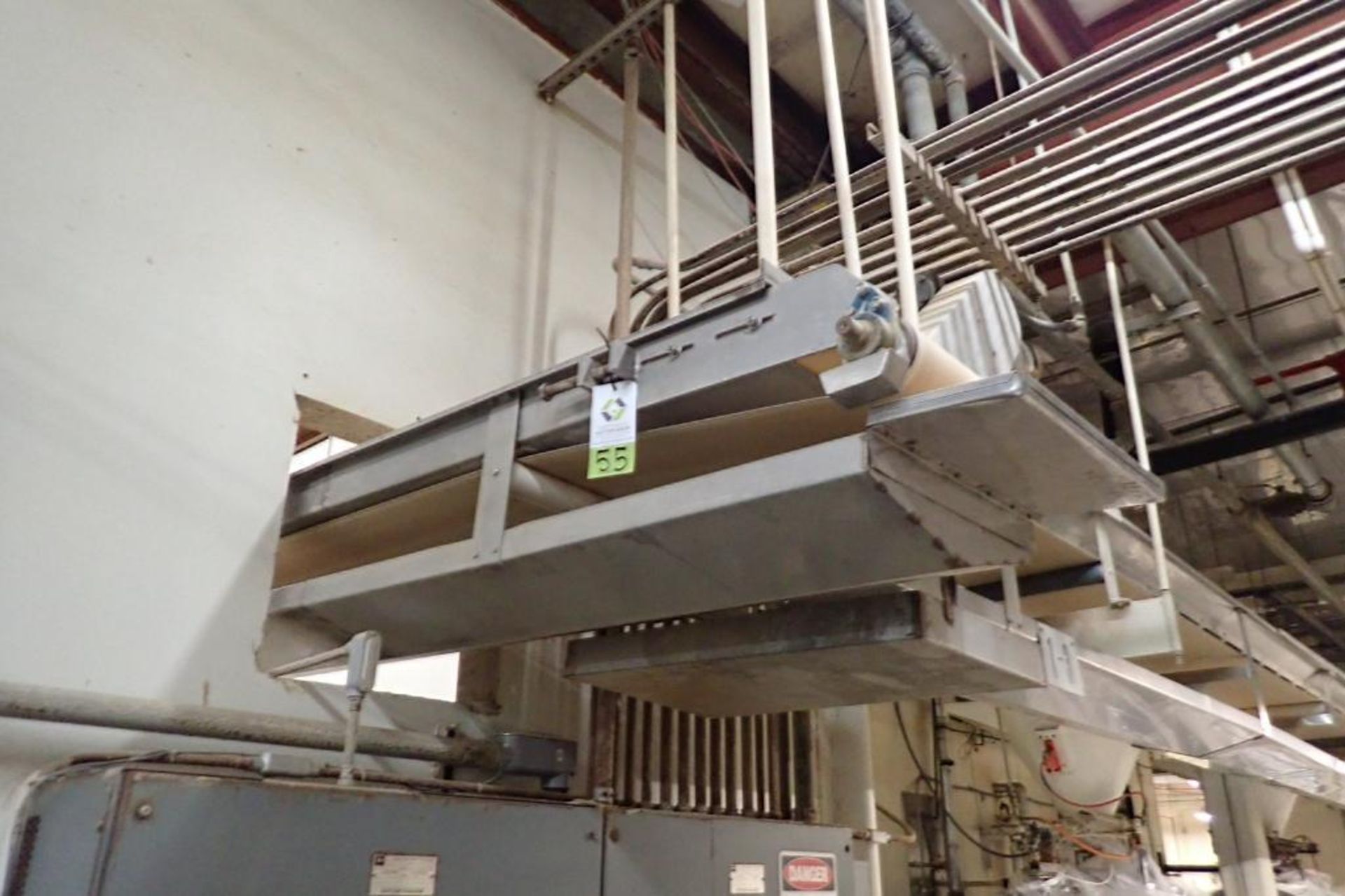 SS belt conveyor, 22 ft. long x 18 in. wide, suspended from ceiling, with motor and drive. **Rigging