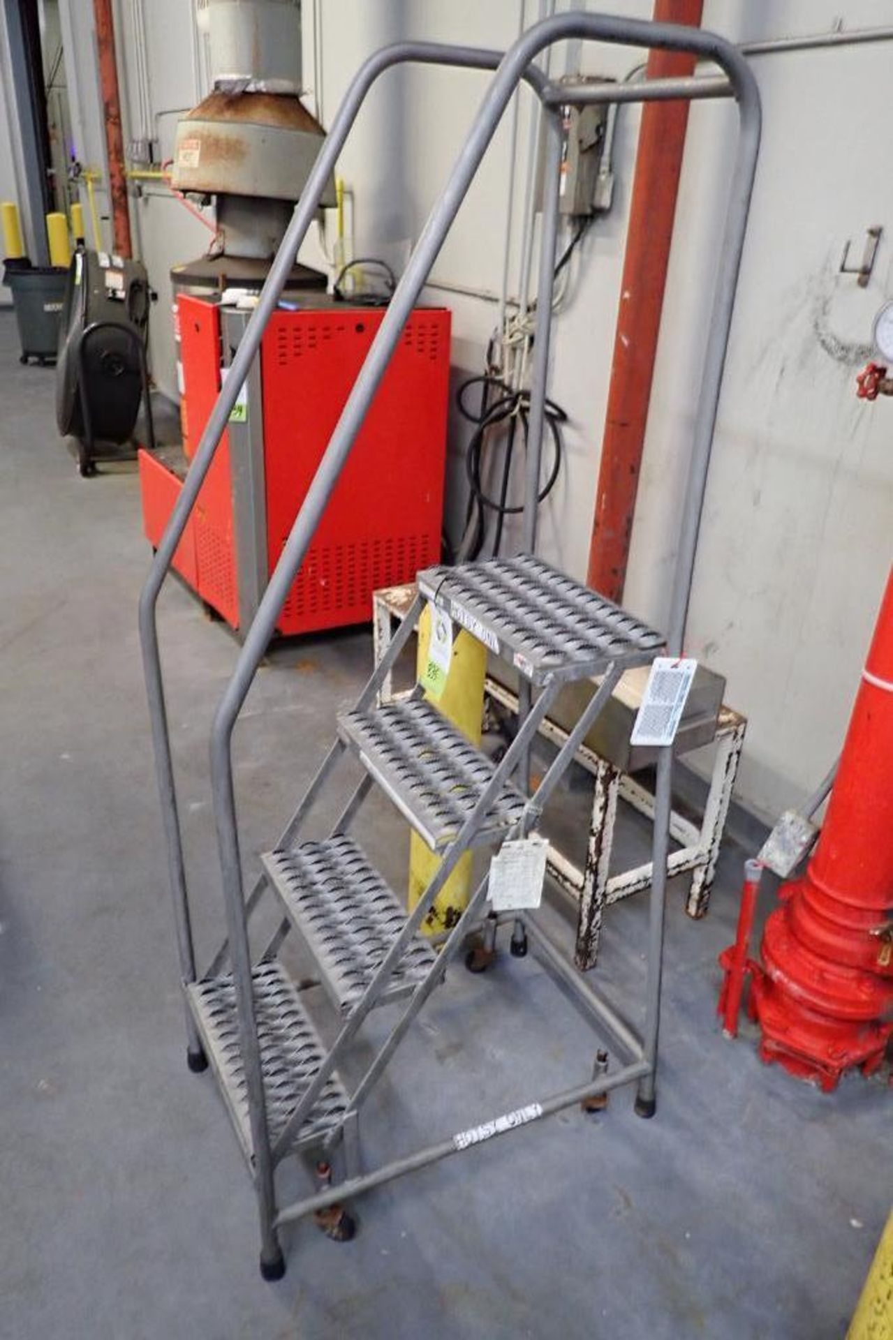Cotterman 4-step stainless steel rolling warehouse ladder. **Rigging Fee: $10** - Image 2 of 4
