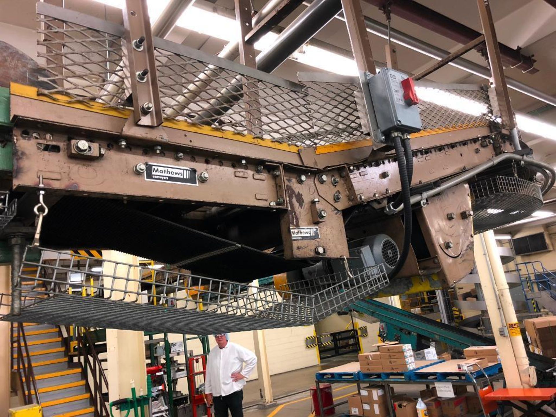 Mathews mild steel over head full case conveyor. (Located in Winona, ON Canada)