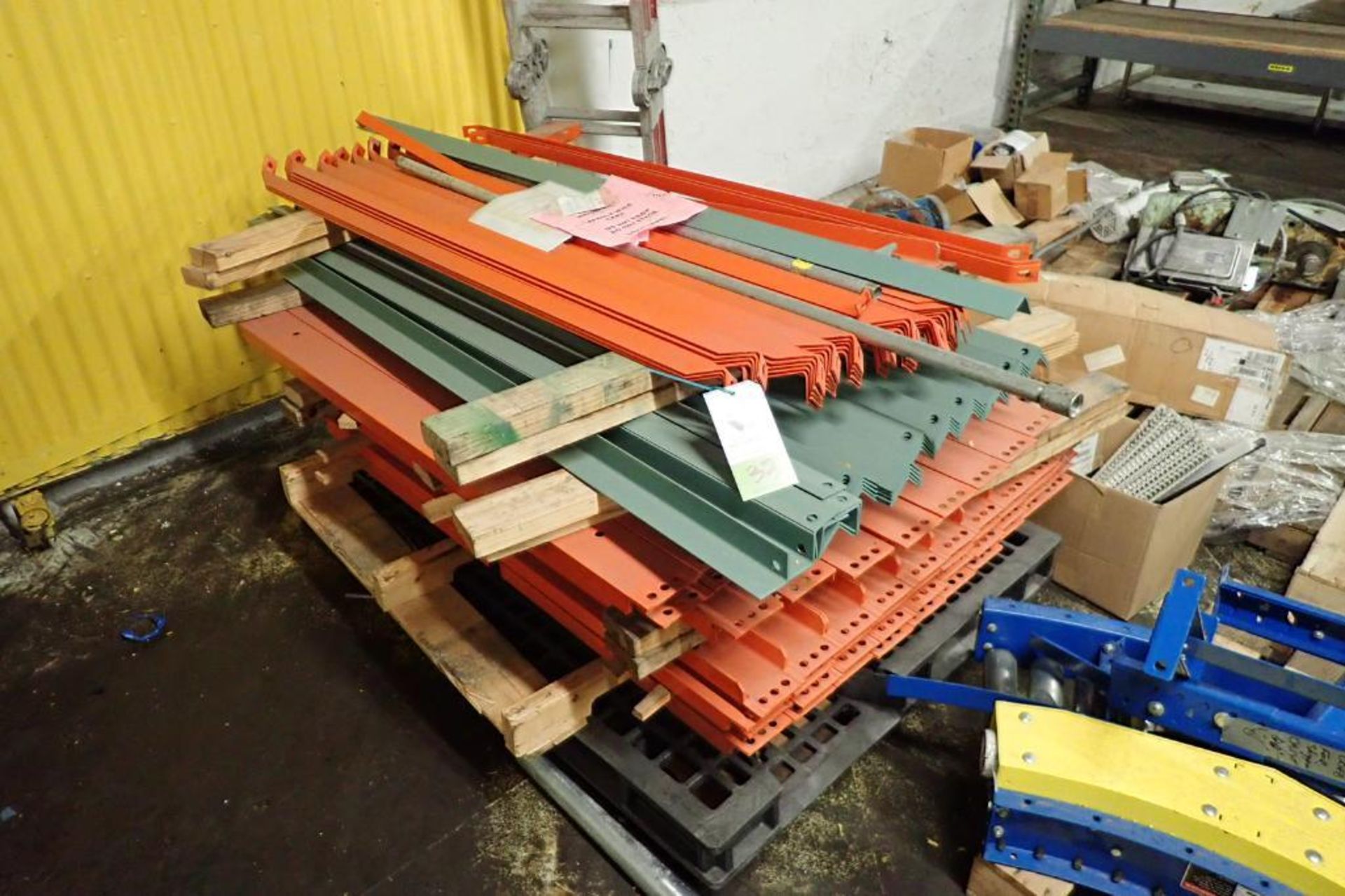 Pallet of wire racking load bars and braces. {Located in Dixon, IL}