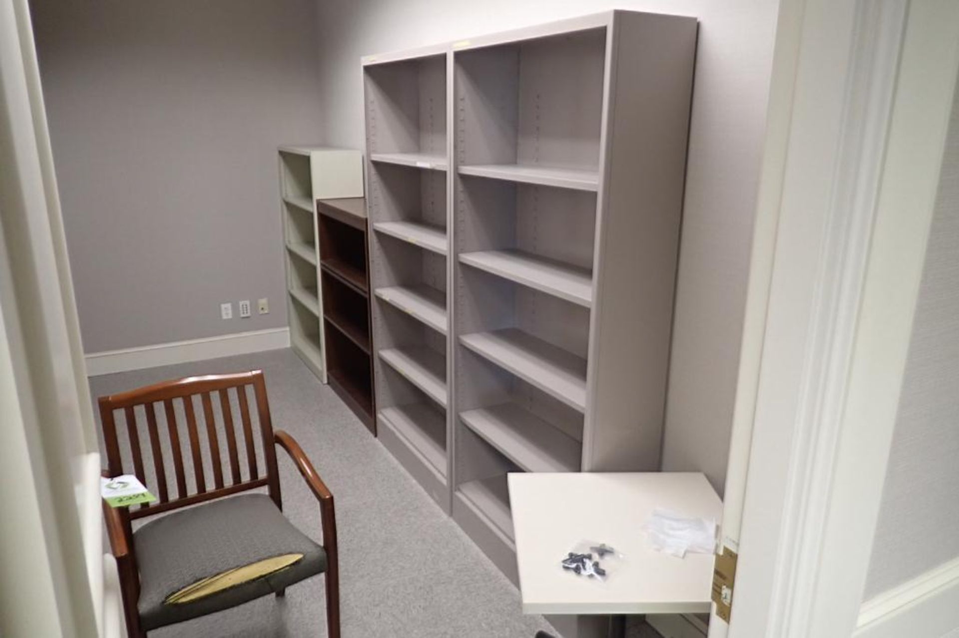 Contents of room, (4) bookshelves, chair