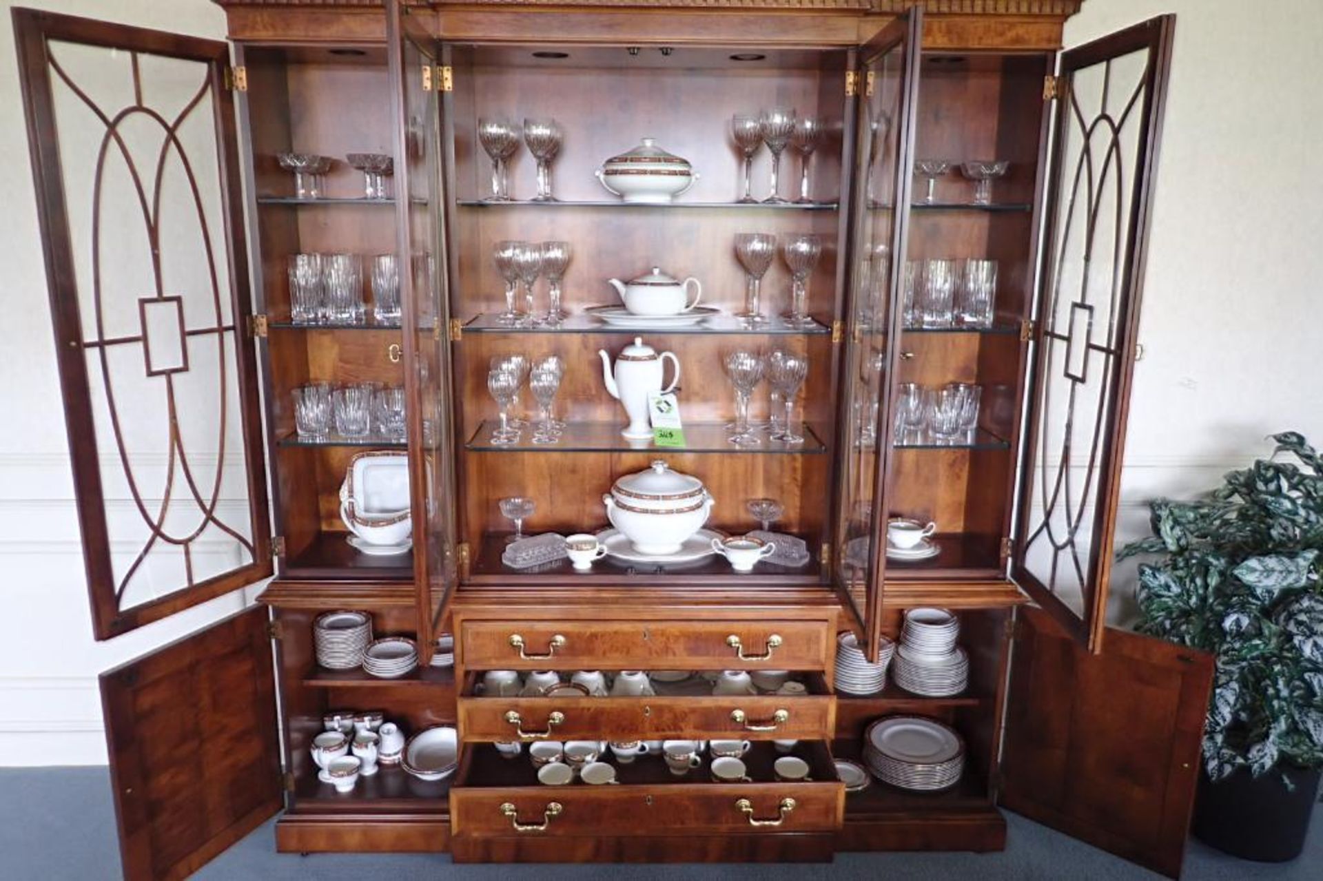 Contents of china hutch including Wedgewood china and Stuart glasses