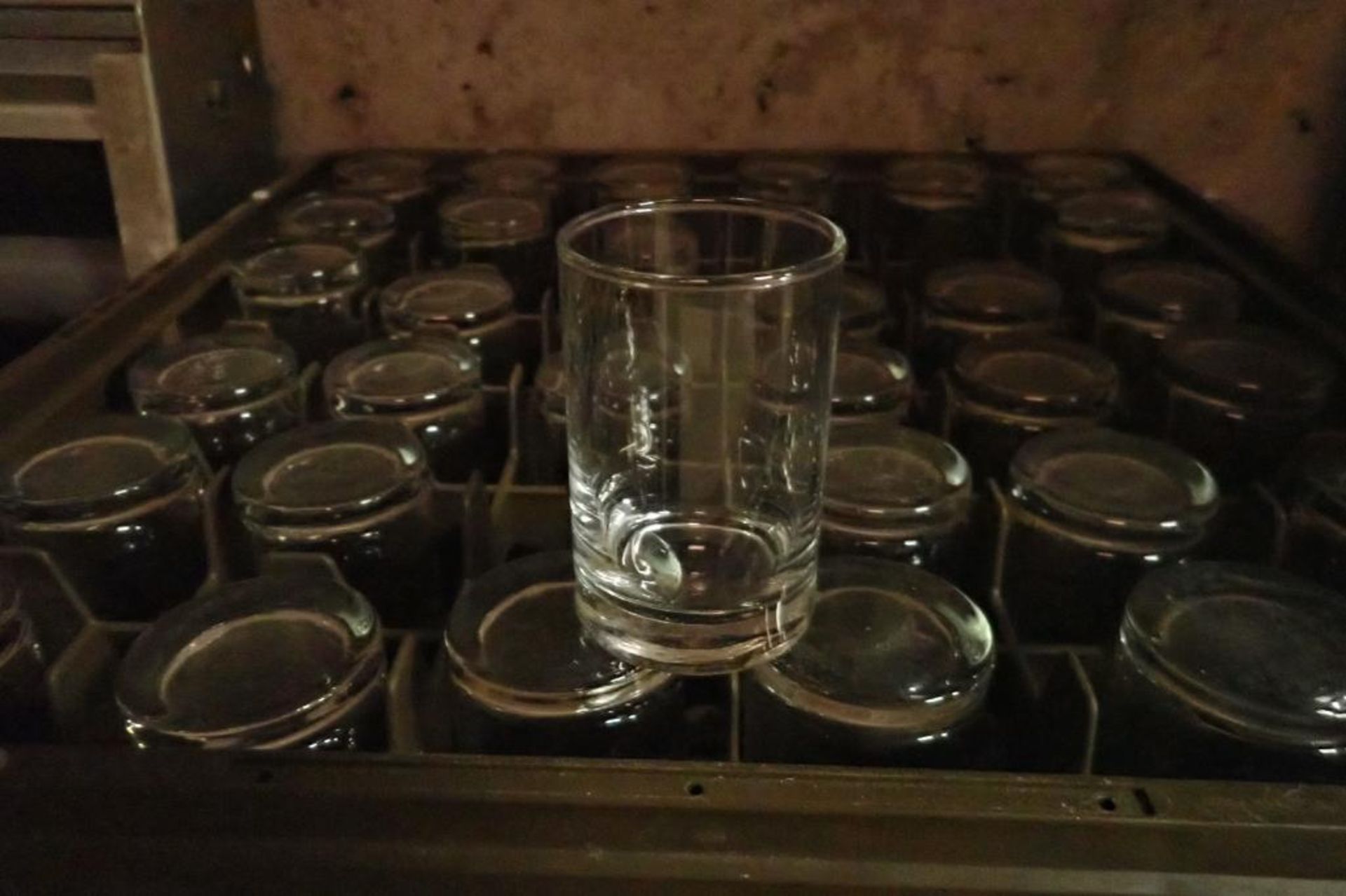 Stackable plastic rack with assorted glasses