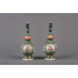 A pair of Chinese famille verte double gourd vases, 19th C.