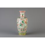 A Chinese famille verte baluster shaped vase with floral design, Kangxi mark, 19th/20th C.