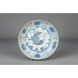 A Chinese blue and white charger with floral design and a lion, Ming, Hongzhi