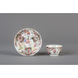 A Chinese famille rose cup and saucer with figures, Yongzheng