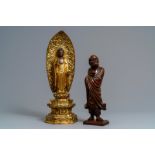 A Japanese giltwood figure of Buddha and a 'Daruma' okimono, Meiji, 19th C.