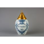 A Dutch Delft blue and white 'Duinkerke' tobacco jar with brass cover, 18th C.