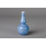 A Chinese monochrome powder blue double gourd vase, 20th C.