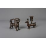 A copper alloy engraved lion shaped aquamanile and a deer candlestick, both items 19th C. or earlier