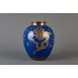 A Chinese gilt dragon decorated blue ground vase, 19th/20th C.