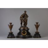 A three-piece black marble clock garniture with on top Pan with a young maiden, France, 19th C.