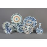 Seven Chinese blue and white and famille verte plates and a blue and white kendi, Ming and Qing