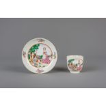 A Chinese famille rose cup and saucer with European subjects, Qianlong
