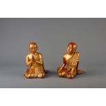 A pair of Thai gilt lacquered servant figures, 19th/20th C.