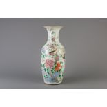 A Chinese famille rose vase with pheasants and floral design, 19th C.