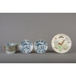 A Chinese famille rose 'butterflies' plate and eleven blue and white dishes, Qianlong and 19th C.