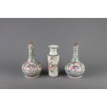 A pair of Chinese famille rose bottle vases and a rouleau vase, 19th C. and Republic