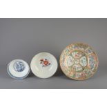A Chinese Canton famille rose bowl, an Imari style bowl and a blue and white bowl, 18th/19th C.