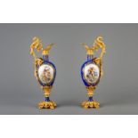 A pair of fine gilt bronze mounted jugs in the Svres manner with putti, France, 19th C.