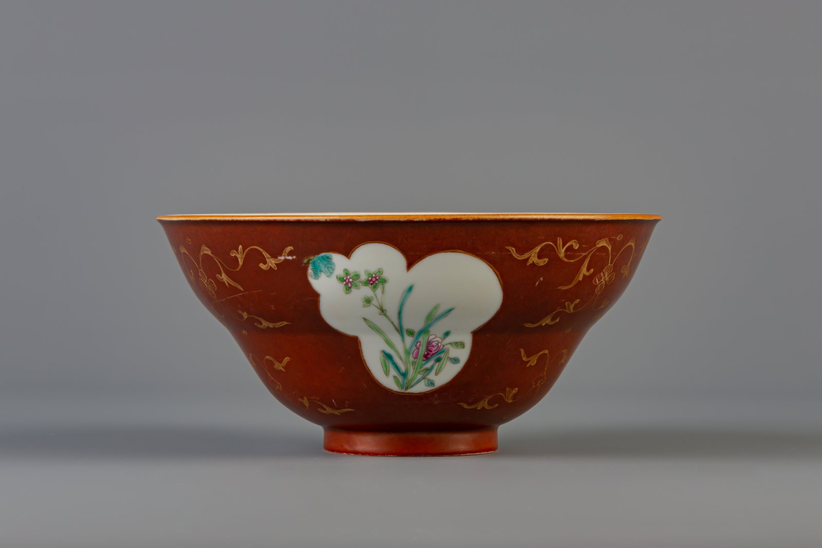 A Chinese famille rose brown ground bowl, Qianlong mark, 19th C.